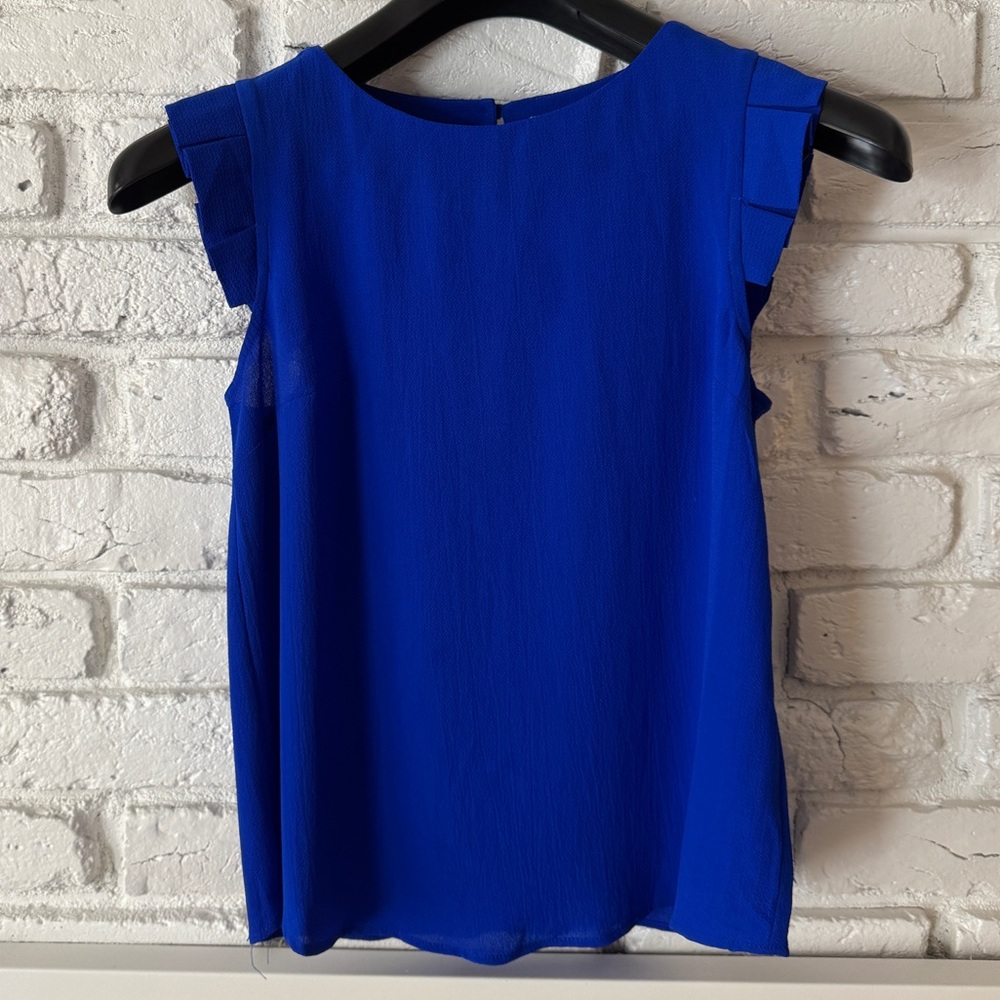 Blue dressy sleeveless top with ruffles